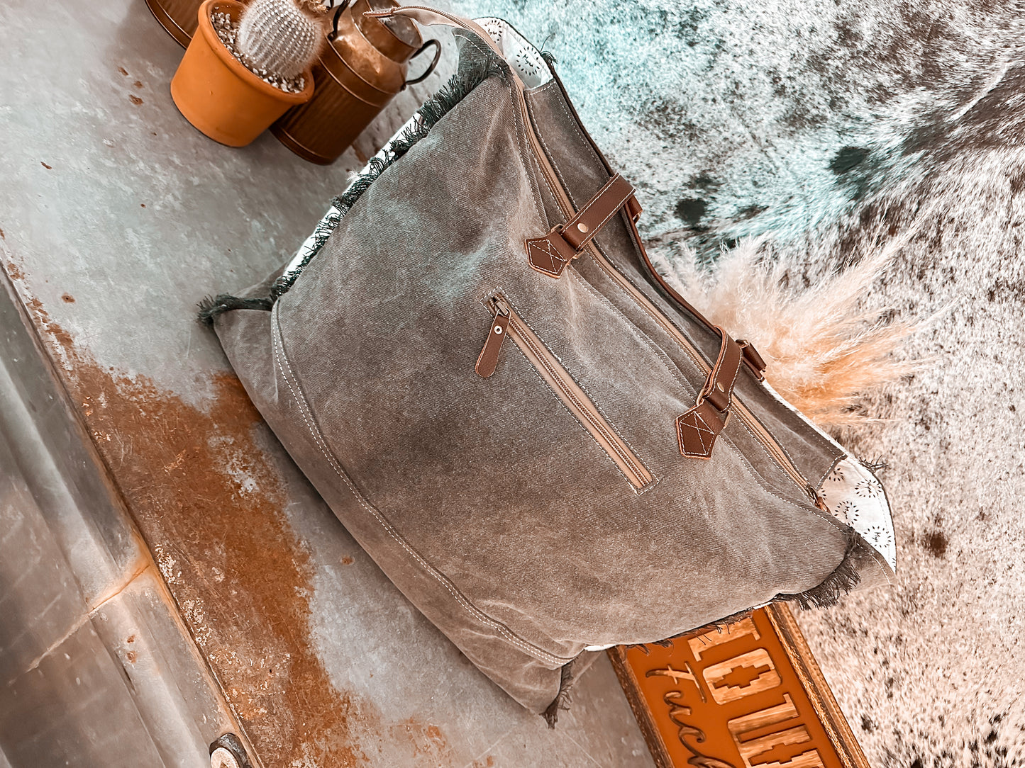 LAINEY’S COWHIDE WEEKENDER TOTE