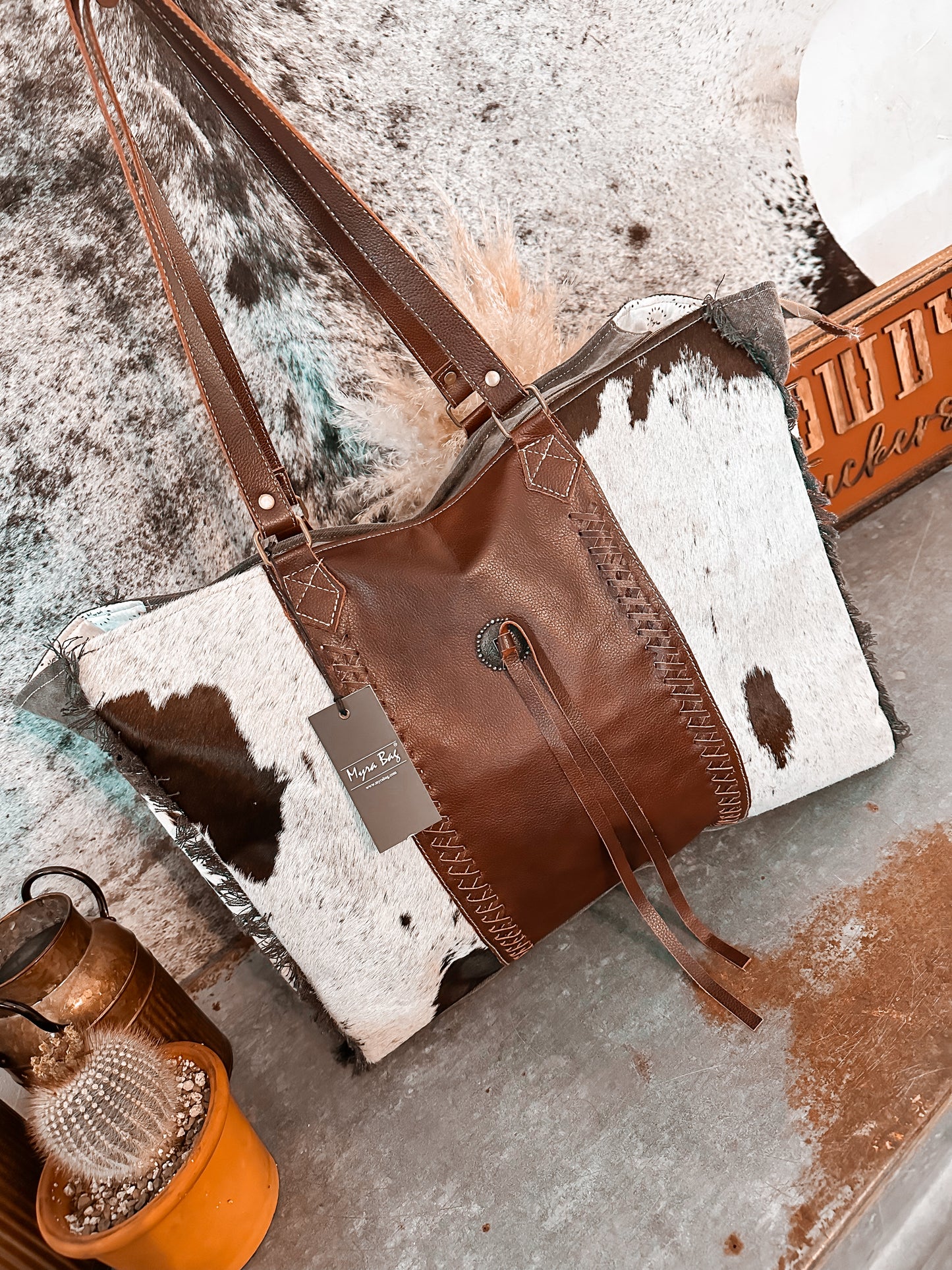 LAINEY’S COWHIDE WEEKENDER TOTE